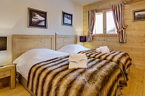 Slaapkamer met de eenpersoonsbedden Les Chalets de Leana